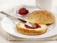 Bread roll with jam — Stock Photo