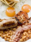 Baked beans, sausage and bacon — Stock Photo
