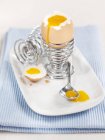 Boiled egg in metal egg-cup — Stock Photo