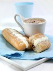 Closeup view of sweet rolls and hot cocoa — Stock Photo