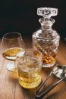Cognac and whisky in glasses — Stock Photo