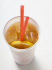 Iced tea with lemon in plastic cup — Stock Photo