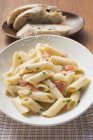 Penne pasta with salmon and sauce — Stock Photo