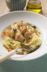 Ribbon pasta with fried scallops — Stock Photo