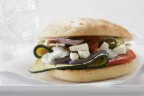 Toasted roll filled with grilled vegetables — Stock Photo