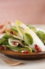 Mixed salad leaves with pomegranate vinaigrette — Stock Photo
