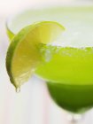 Lime wedge on cocktail glass — Stock Photo