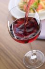 Red wine into glass — Stock Photo