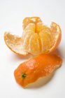 Partly peeled clementine — Stock Photo