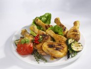 Grilled chicken legs and vegetables — Stock Photo