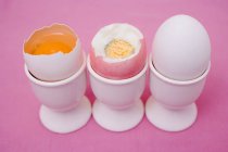 Three eggs in eggcups — Stock Photo