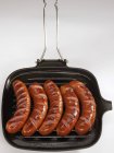 Bockwurst sausages in grill pan — Stock Photo
