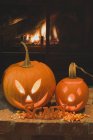 Pumpkin lanterns and candy corn — Stock Photo