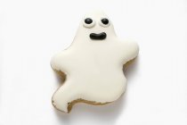 Ghost biscuit with white icing — Stock Photo