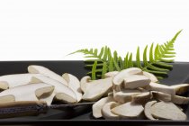 Closeup view of sliced ceps mushrooms on a serving plate — Stock Photo