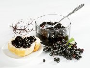 Elderberry jam on bread — Stock Photo