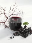 Glass of elderberry and apple juice — Stock Photo