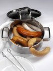 Types of sausages in pan — Stock Photo