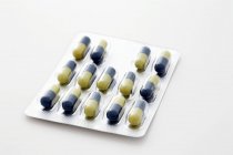 Closeup view of one packaging with colored capsules — Stock Photo