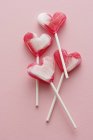 Four heart-shaped lollipops — Stock Photo