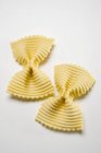 Two farfalle pasta pieces — Stock Photo