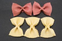 Five farfalle pasta pieces — Stock Photo