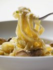 Ribbon pasta with ceps and Parmesan — Stock Photo