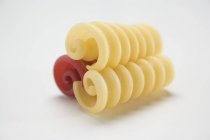 Closeup view of three Riccioli pasta curls — Stock Photo
