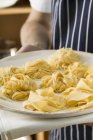 Three types of ribbon pasta on tray — Stock Photo