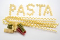 Palabra Pasta de trozos de pasta de ruedas - foto de stock