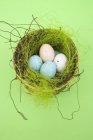 Chocolate eggs in nest — Stock Photo