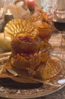 Closeup view of cranberries in glass bowl on laid table — Stock Photo