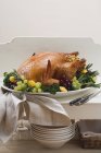 Stuffed turkey with herbs and grapes — Stock Photo