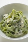 Green ribbon pasta with Gorgonzola sauce — Stock Photo