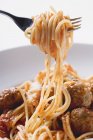 Spaghetti on fork with meatballs — Stock Photo