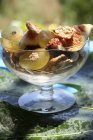 Closeup view of fig and grape salad with crispy flakes — Stock Photo