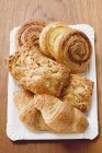 Elevated view of assorted Danish pastries on a paper plate — Stock Photo