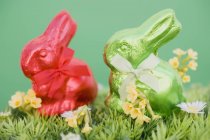 Red and green Easter Bunnies — Stock Photo