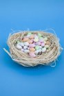 Sugar eggs over blue background — Stock Photo