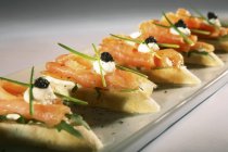 Salmon and caviar canapes — Stock Photo
