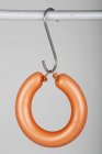 Closeup view of a Ringwurst sausage hanging on a hook — Stock Photo