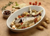 Sea bream with potatoes and herbs — Stock Photo