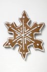 Gingerbread snowflake on white — Stock Photo