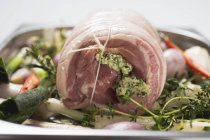 Rolled pork roast with herb stuffing — Stock Photo