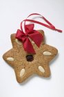 Gingerbread star with almonds — Stock Photo
