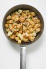 Fried potatoes with vegetables and bacon — Stock Photo