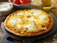 Tomato and mozzarella pizza — Stock Photo