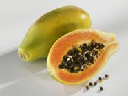 Fresh Whole and half papaya — Stock Photo
