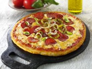 Pepperoni pizza with chilli rings — Stock Photo