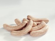 Raw veal sausages — Stock Photo